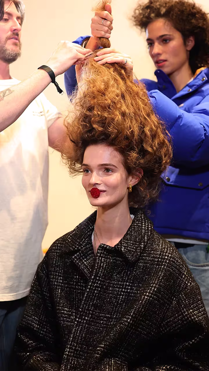 Working on a Runway model's hair